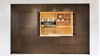Illustration for article titled These Cabinets Hide an Incredible Stealth Kitchen